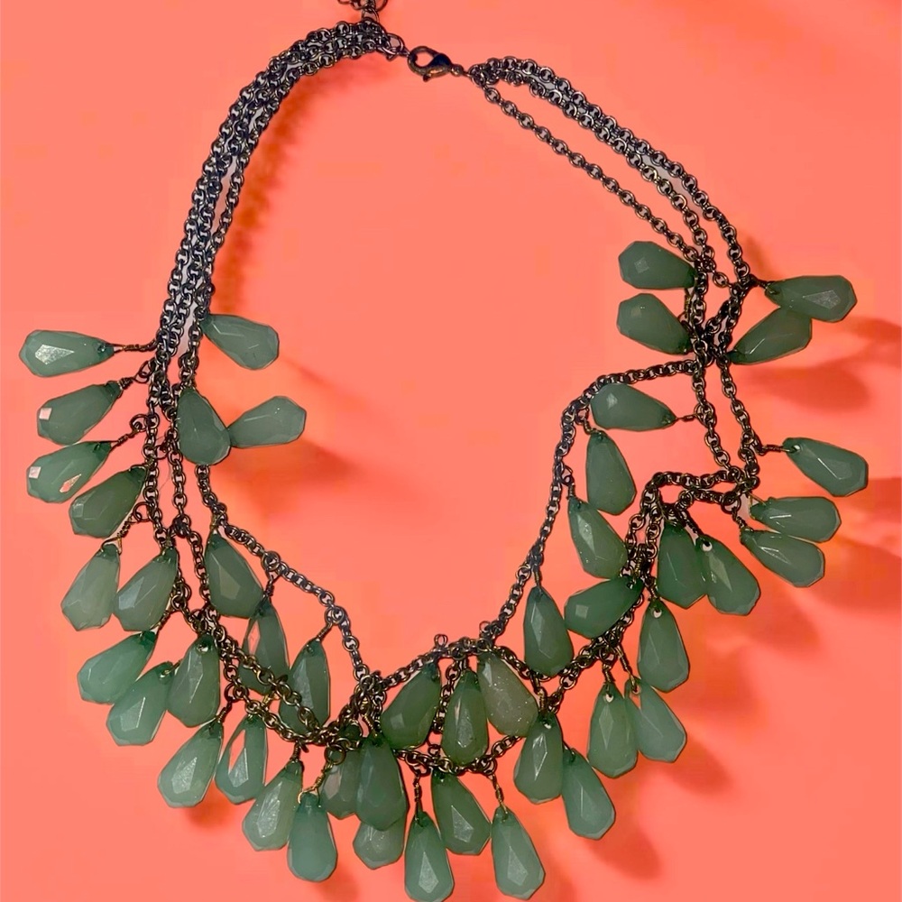 Emeral necklace used in good condition it’s sterling silver